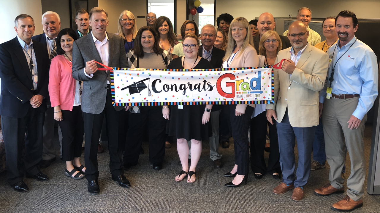 Entergy leaders joined nuclear finance staff to congratulate Denise McPherson (pictured front, centered) upon completion of the Massachusetts Institute of Technology Reactor Technology Course for Utility Executives.